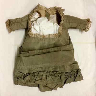 Doll Dress of Pale Gree Taffeta with lace trim, c. 1880