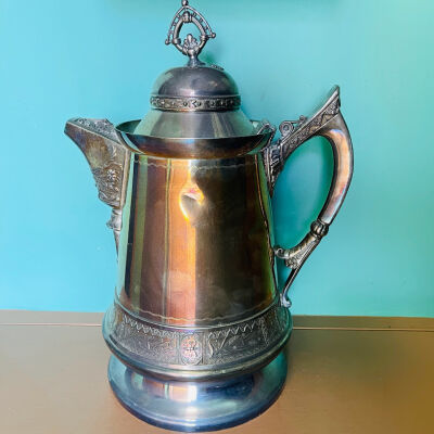 Circular Holman Silver-plated pitcher with flora and fauna motifs, c. 1890