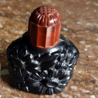 Black glass perfume bottle with rose plastic screw top, prior 1997