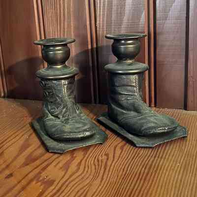 Bronzed baby shoes of Florence Boone turned into candle holders, before 1999