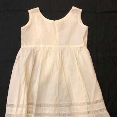 Girl's white cotton petticoat with lace & feather stitching, c. 1900