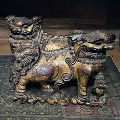 Carved wooden asian temple dogs with gold leaf finish