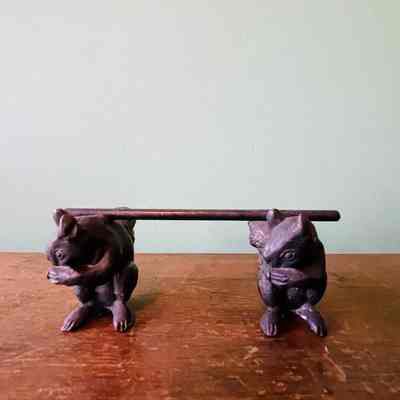 Silver plated knife rest shaped like a bar supported by squirrels, c. 1890s