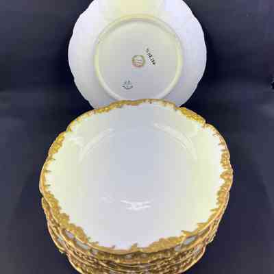 Set of bread and butter dishes with roses and filigree, c. 1910