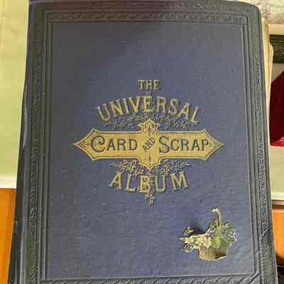 Blue buckram covered scrap album of cards, c. 1880s
