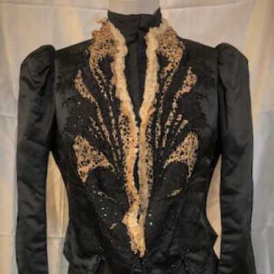 Black silk brocade blouse jacket with ecru lace trim and rhinestones, 1898 - 1900