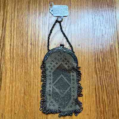 Crocheted purse with steel cut beads and silver frame and chain handle, early 1900s