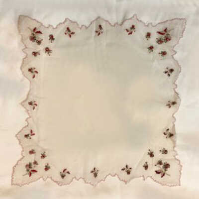 White linen handkerchief with red and yellow flowers