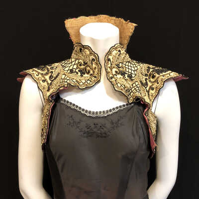 Off-white wool collar with gold metallic cord, black braid, and beads, c. 1900