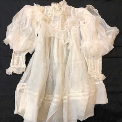 Girl's baby dress of white voile with puffed sleeves, c. 1890s
