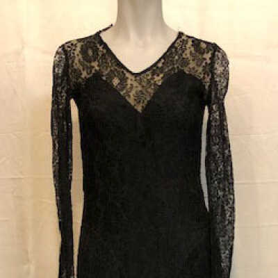 Black lace scooped neck dress with long sleeves and diagonal lace at hip, 1930