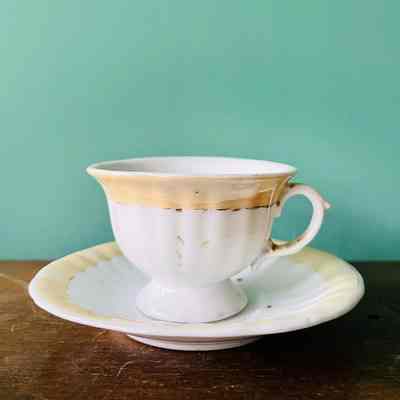 Porcelain demitasse cup and saucer with brown border, c. 1900