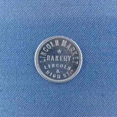 Token for a small loaf of bread Lincoln Market Bakery, c. 1950s