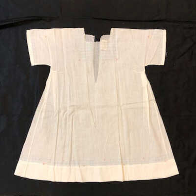 White lawn baby dress with embroidered block pattern and pink flowers, c. 1920s