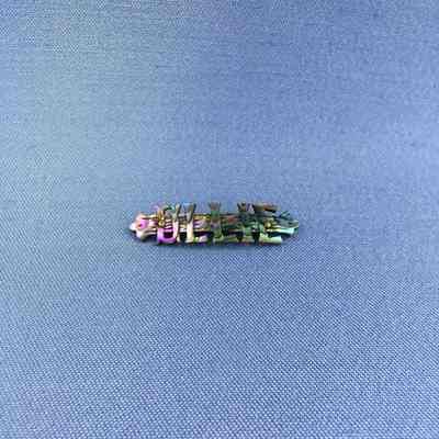 Bar pin of mother-of pearl block letters of Olive (Ollie) Toye, c. 1900