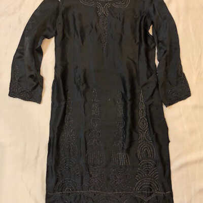 Black silk sheath dress with art deco iridescent bead decorations, 1920s