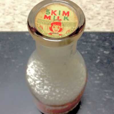 Alameda Dairy 1 Quart Bottle with Skim Milk bottle cap, c. 1940.