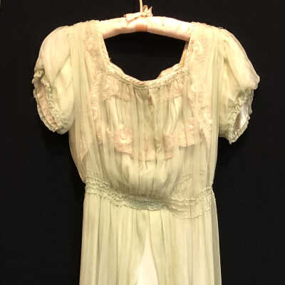 Lime green dress over green liner with embroiderd flowers, c. 1912