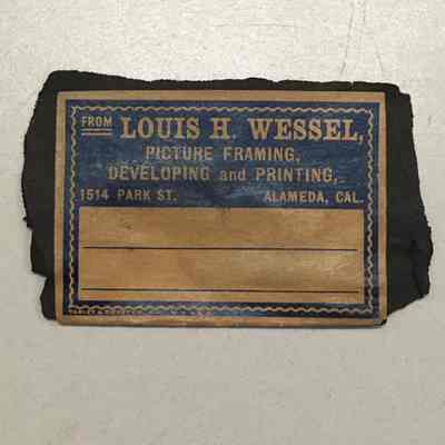 Label from Louis H. Wessel, picture framing, c. 1909