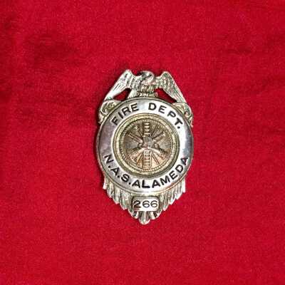 Nickel-plated NAS Alameda Fire Dept. badge, number 266, prior 1997