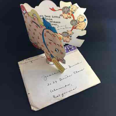 Envelope and Birthday card holding dimes sent to Judith Ann Smith, 1946