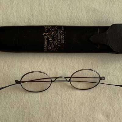 Oval Shaped Silver plated eyglasses in black case from California Optical Co., early 1900s