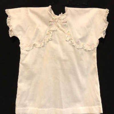White cotton child's dress with lace trim and machine embroidery, 1927