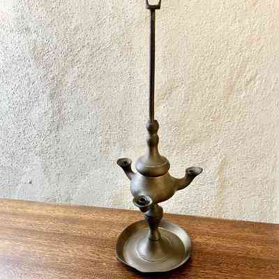 Patinated brass reproduction of an ancient oil lamp, prior 1997