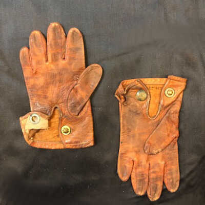 Pair of Child's brown gloves from Eugenia Clinchard, c. 1911