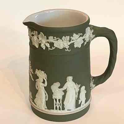 Wedgewood Jasperware pitcher with women and border of grapes and leaves, c. 1900