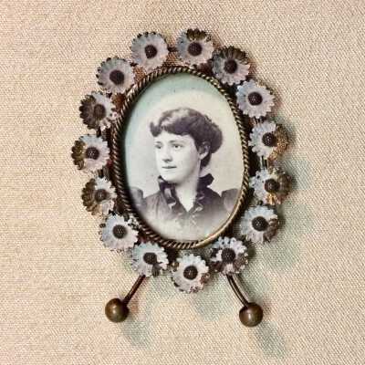 Framed photo of a girl, from 1125 Morton Street, c. 1890