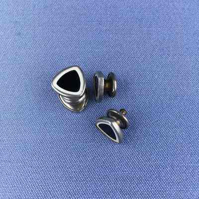 Stud-cufflink wit black and white celluloid heads, c. 1920s