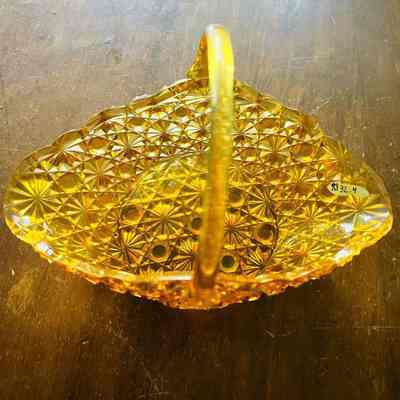 Amber glass dish with button and daisy pattern, early 1900s