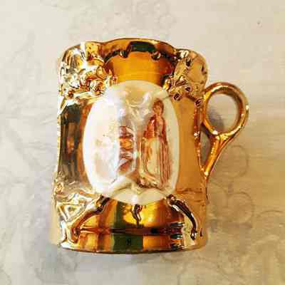 German porcelain mug with a lady and a musician, c. 1890s