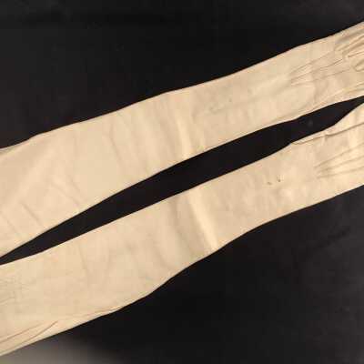 Pair of full-length white kid gloves, size 5 3/4 with snap-on mother-of-pearl buttons, early 1900s