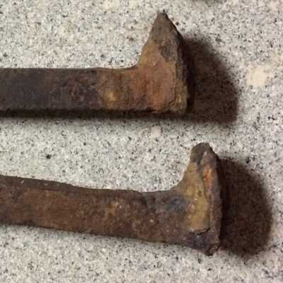 2 Railroad spikes from Lincoln Avenue, before 1960