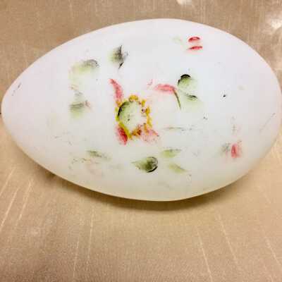 White glass egg with floral design paint remnants, early 1900s