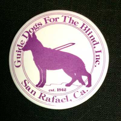 Badge for the Guide Dogs for the Blind organization, prior 2014
