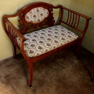 Parlor loveseat with back with carved flowers and leaves, 1890s