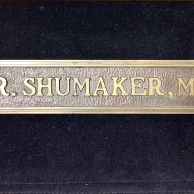 Door sign of the office of Paul Shumaker, M.D., prior 2009