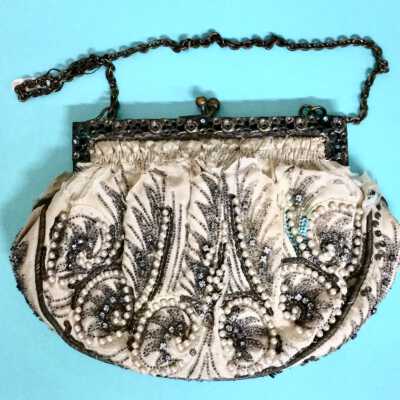 Purse of cream-colored silk with embroidery, beads, and pearls, c. 1920s-1930s