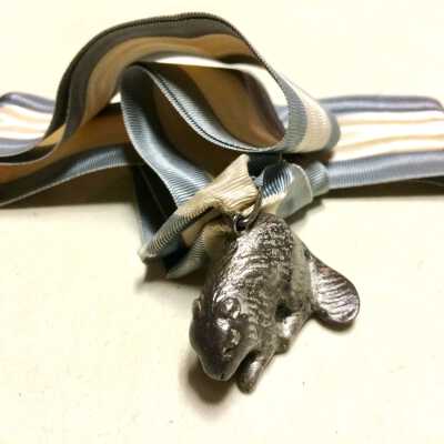 Ribbon with beaver figure of William Cox, c. 1920s