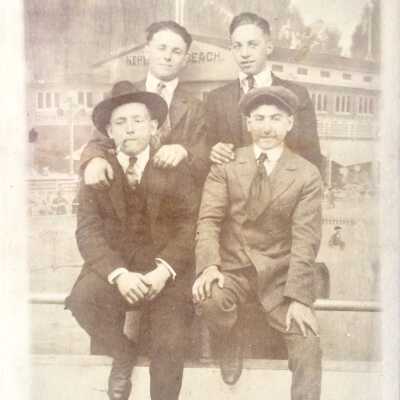 Photo Postcard of four boys at Neptune Beach, c. 1915