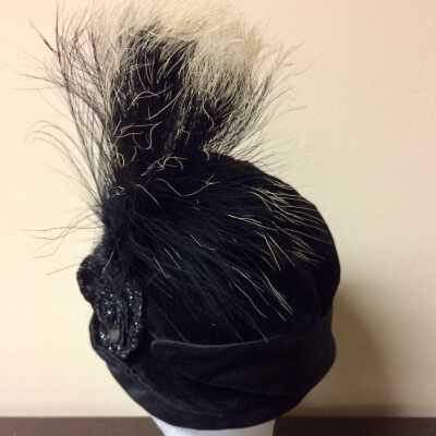 Black velvet pseudo cloche hat with white tipped feather ornament, 1920s