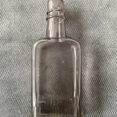 Amethyst colored glass liquor bottle from the Blake-Dyer family, before WWI