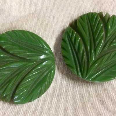 Green round celluloid dress clips with embossed leaf, 1930s or 1940s