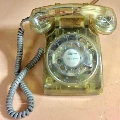 Clear plastic Bell Systems telephone from Anniversary Dialed Call, 1976