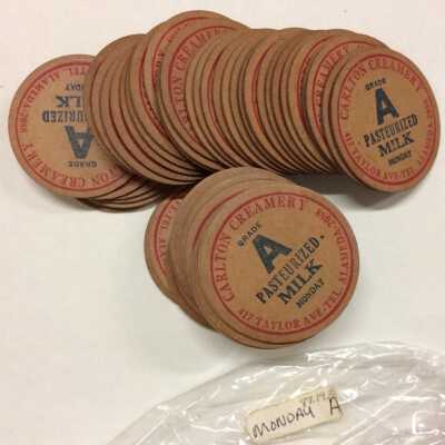 Cardboard bottle caps from the Carlton Creamery, before 1923