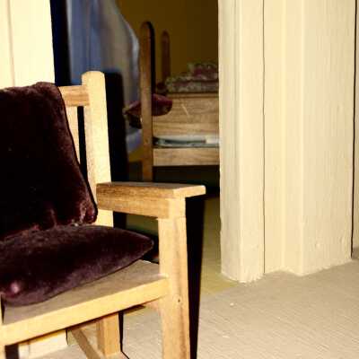 Rocking chair (1983.32.1.10): One of te rocking chairs has two brown velvet cushions