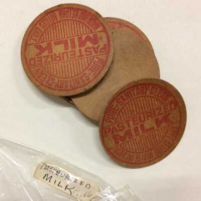 Cardboard pasteurized milk bottle caps from the Carlton Creamery, before 1923